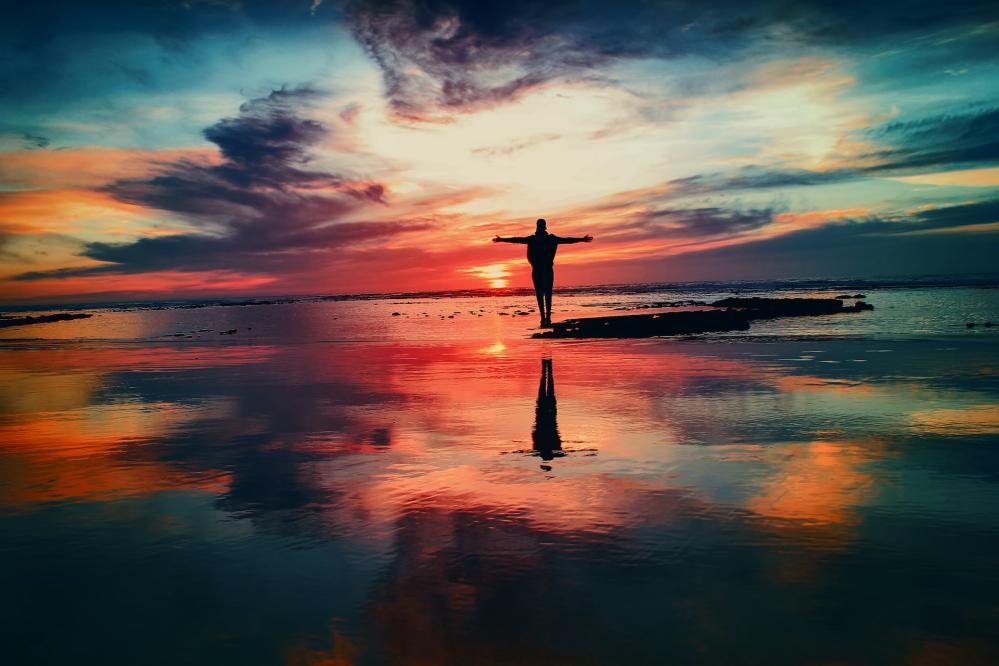 person beach reflected colours